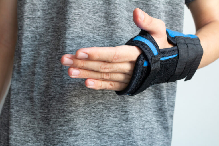 Patient undergoing an orthopedic hand and wrist examination following a traumatic injury.