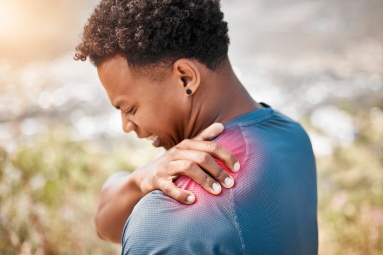 Mature individual experiencing chronic shoulder joint pain.