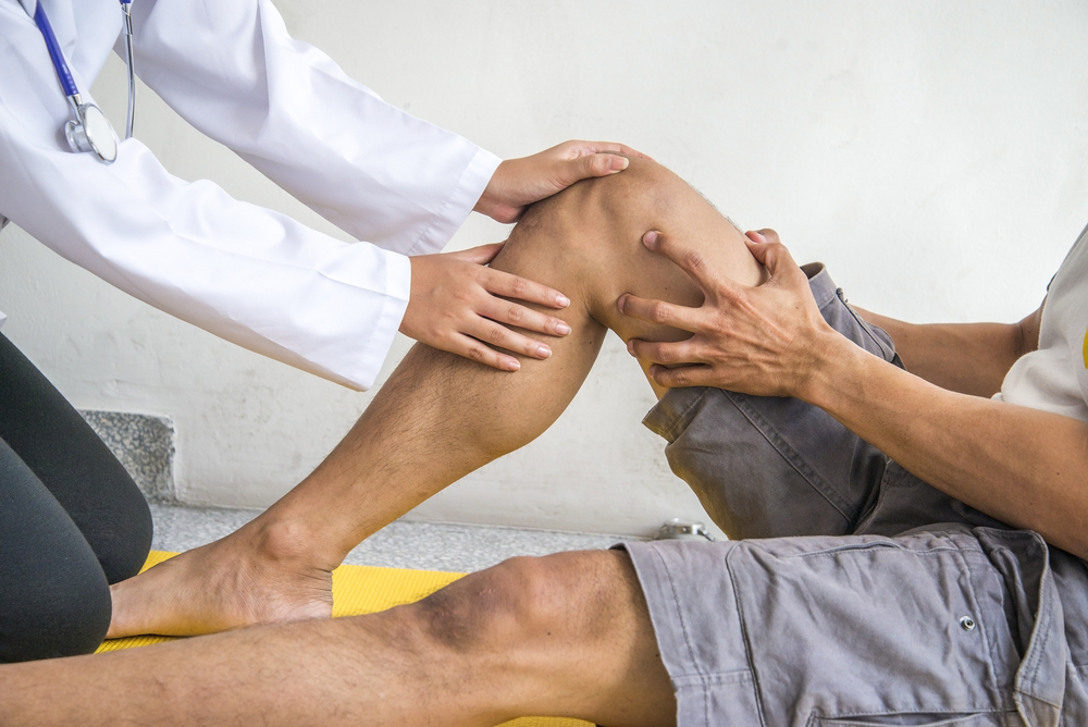 Physiotherapist Giving Exercise In Clinic