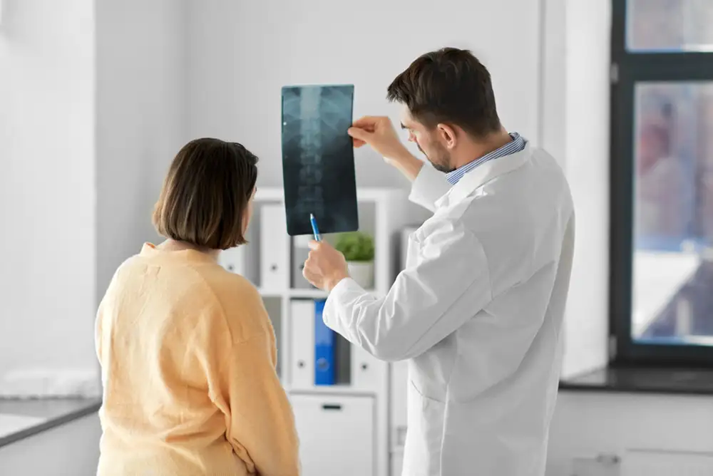 doctor and patient reviewing xray